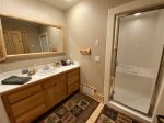 Master bathroom with large shower and bathtub areas.